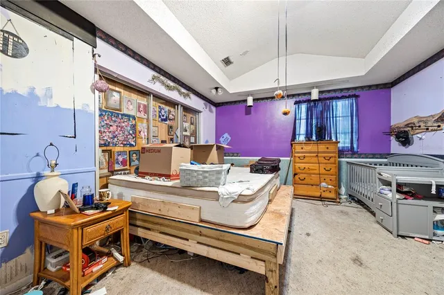 a view of a dining room with furniture a rug and a window