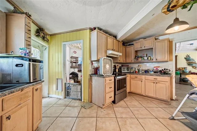 a room with lots of furniture and white walls