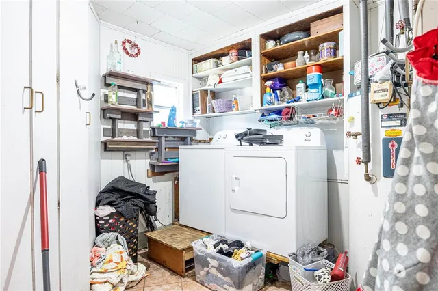a living room with furniture and a mirror