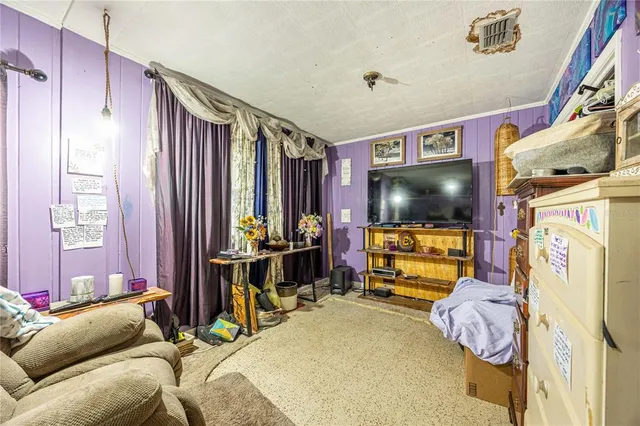 a bedroom with bed and a window