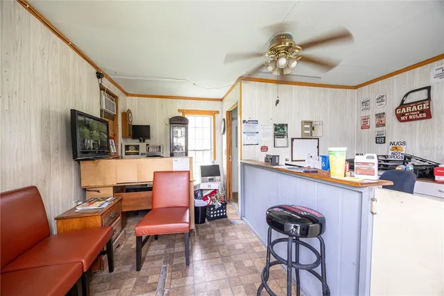 a view of backyard with a car parked in it