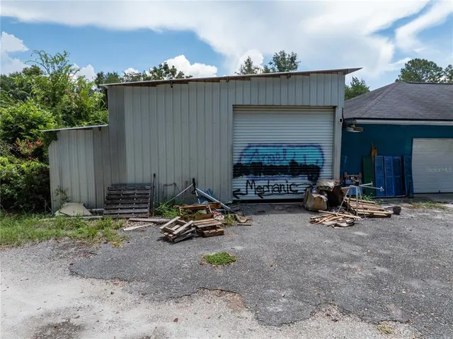 a view of a backyard with a barn