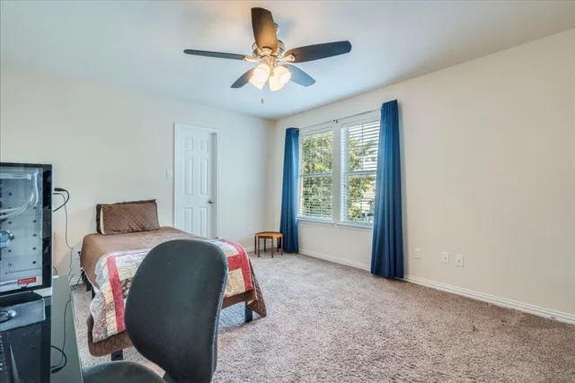 a bed room with a bed and a window