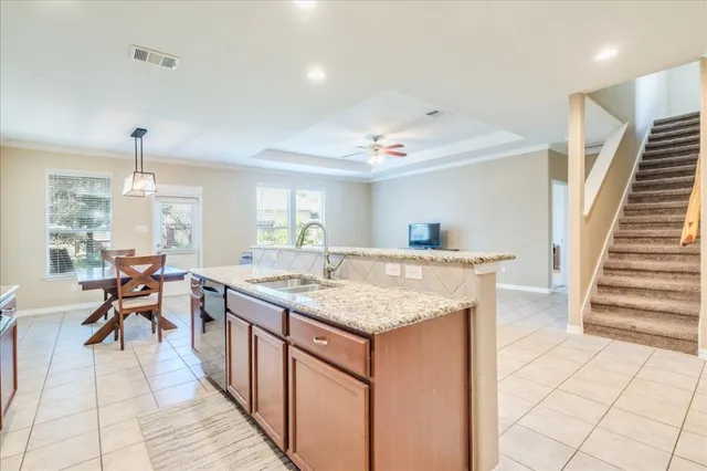 a kitchen with counter top space and sink