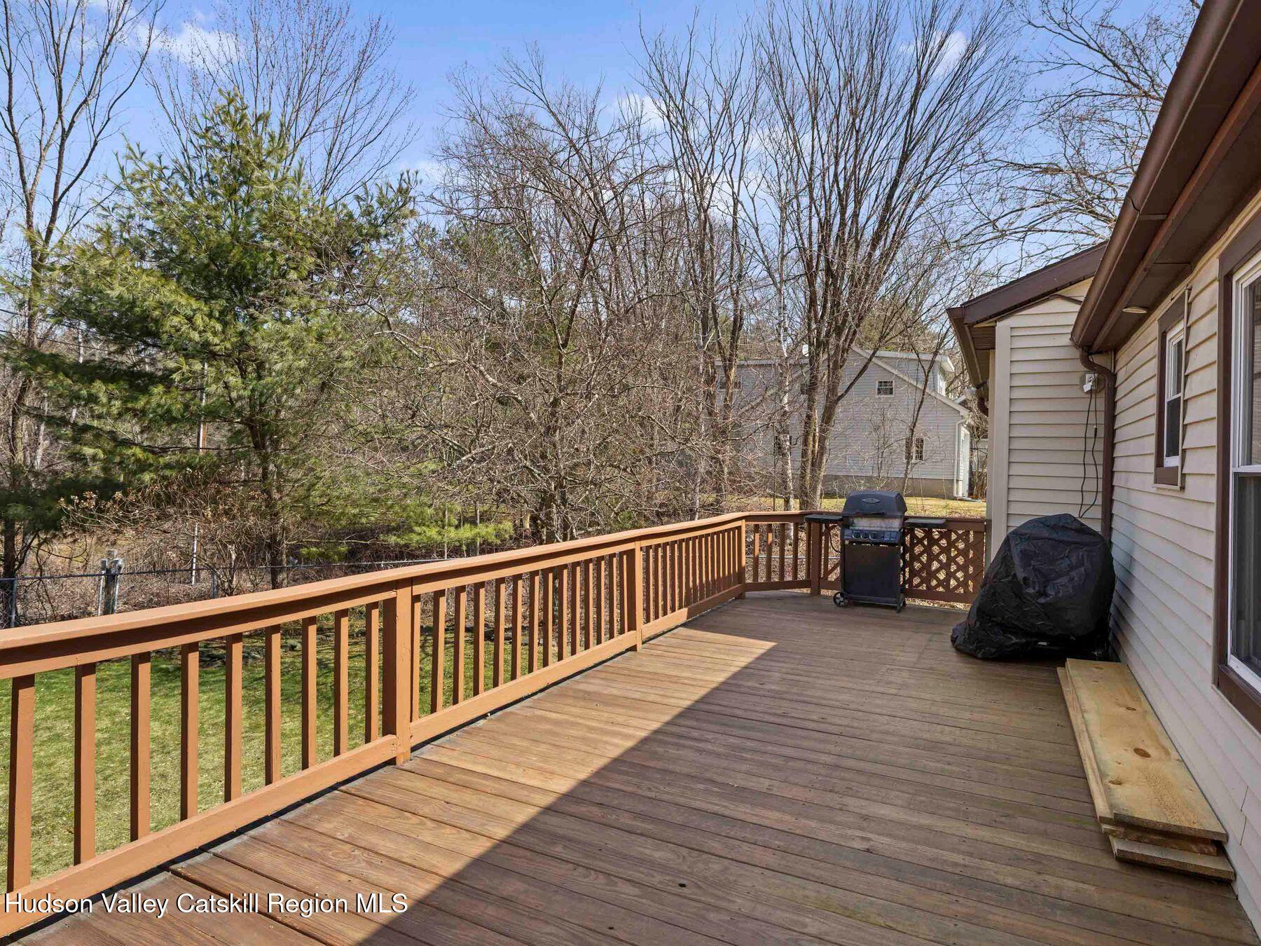 382 Cairo Junction Road Catskill, NY 12414 - Photo 20 of 38 a view of a balcony with couches and wooden floor