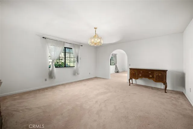 a view of a livingroom with furniture and a window