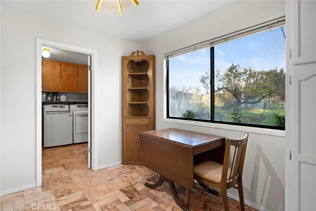 a view of a livingroom with furniture and front door