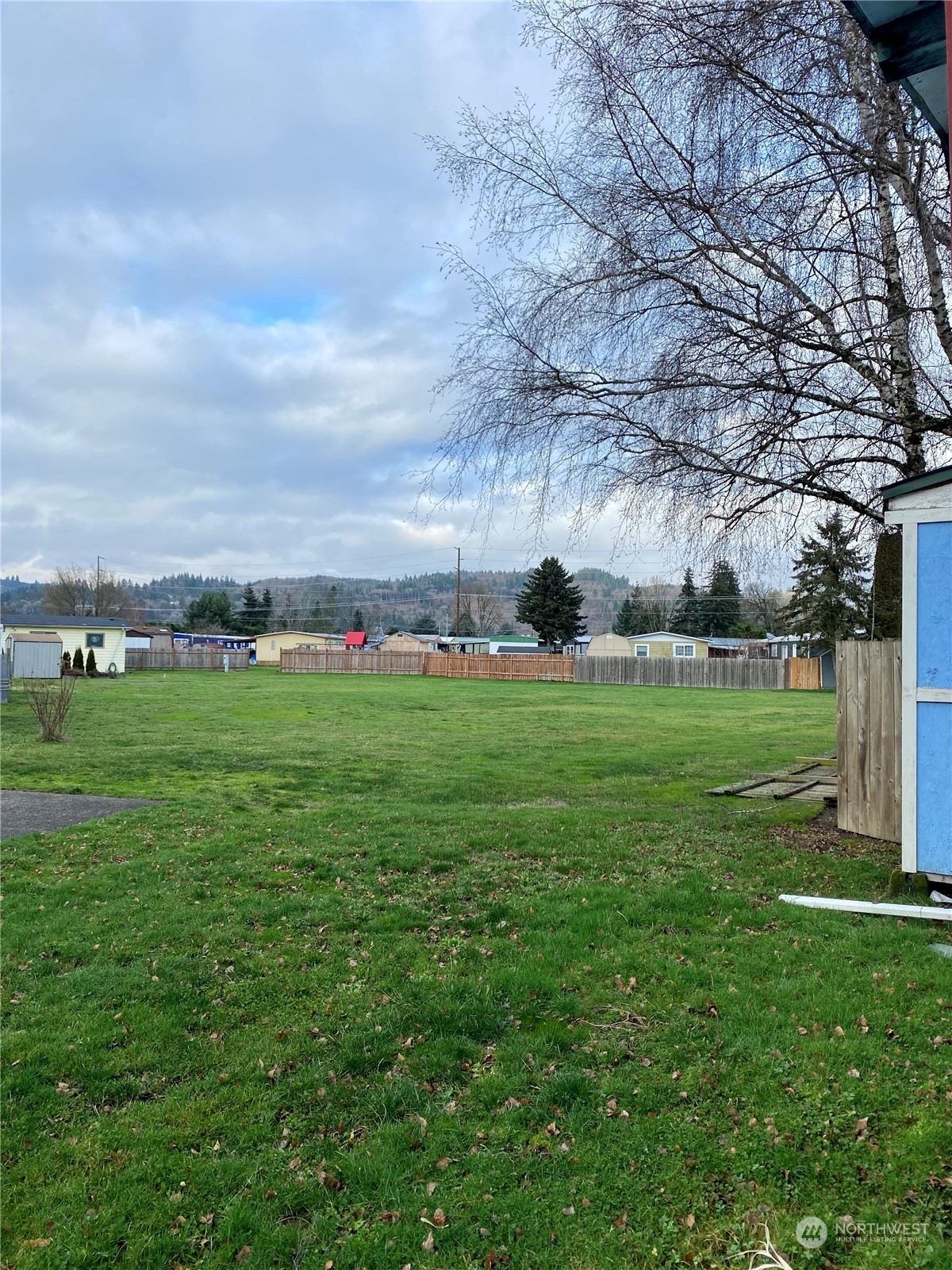 5600 Mt Solo Road, Unit 73 Longview, WA 98632 - Photo 18 of 18 a view of yard with grass & wall