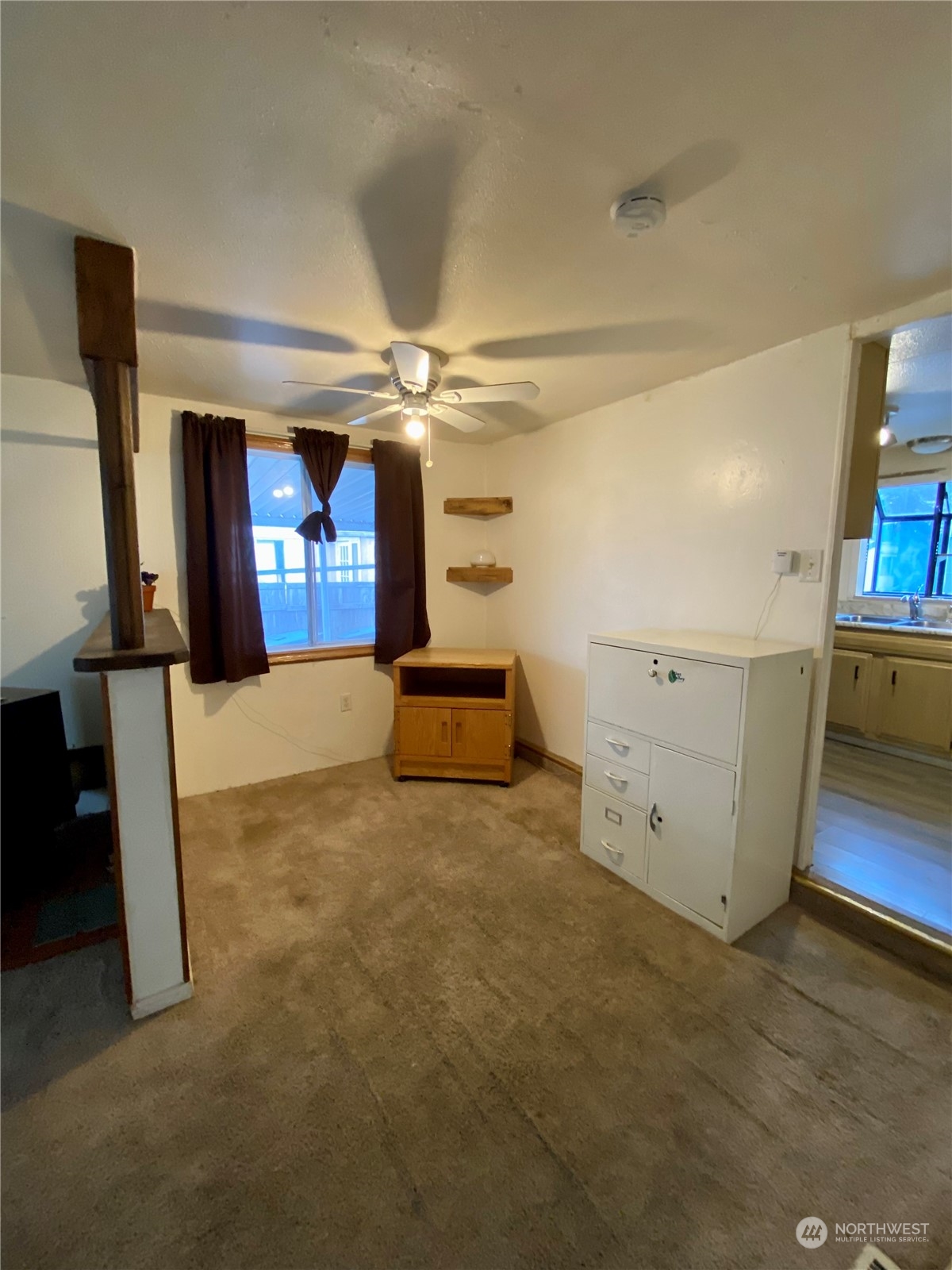 5600 Mt Solo Road, Unit 73 Longview, WA 98632 - Photo 9 of 18 a view of a livingroom with wooden floor and cabinet
