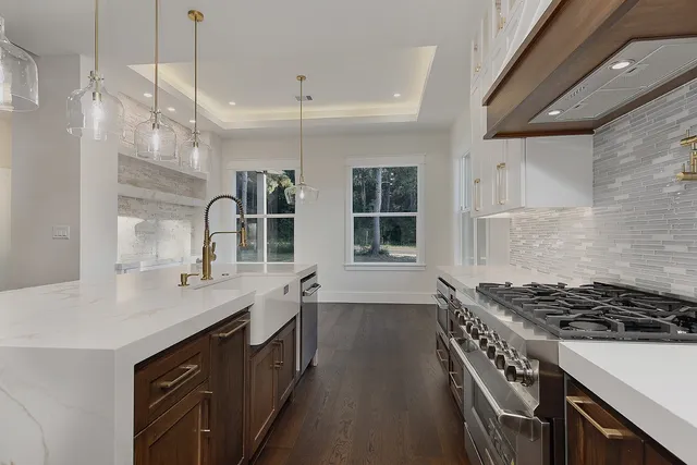 a spacious bathroom with a bathtub shower sink and mirror