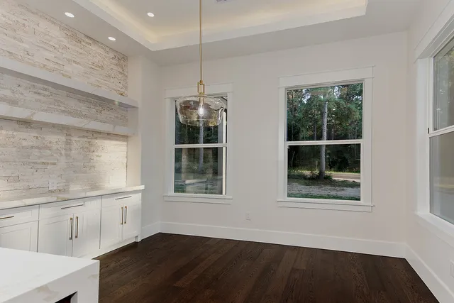 a view of a livingroom with a ceiling fan and window