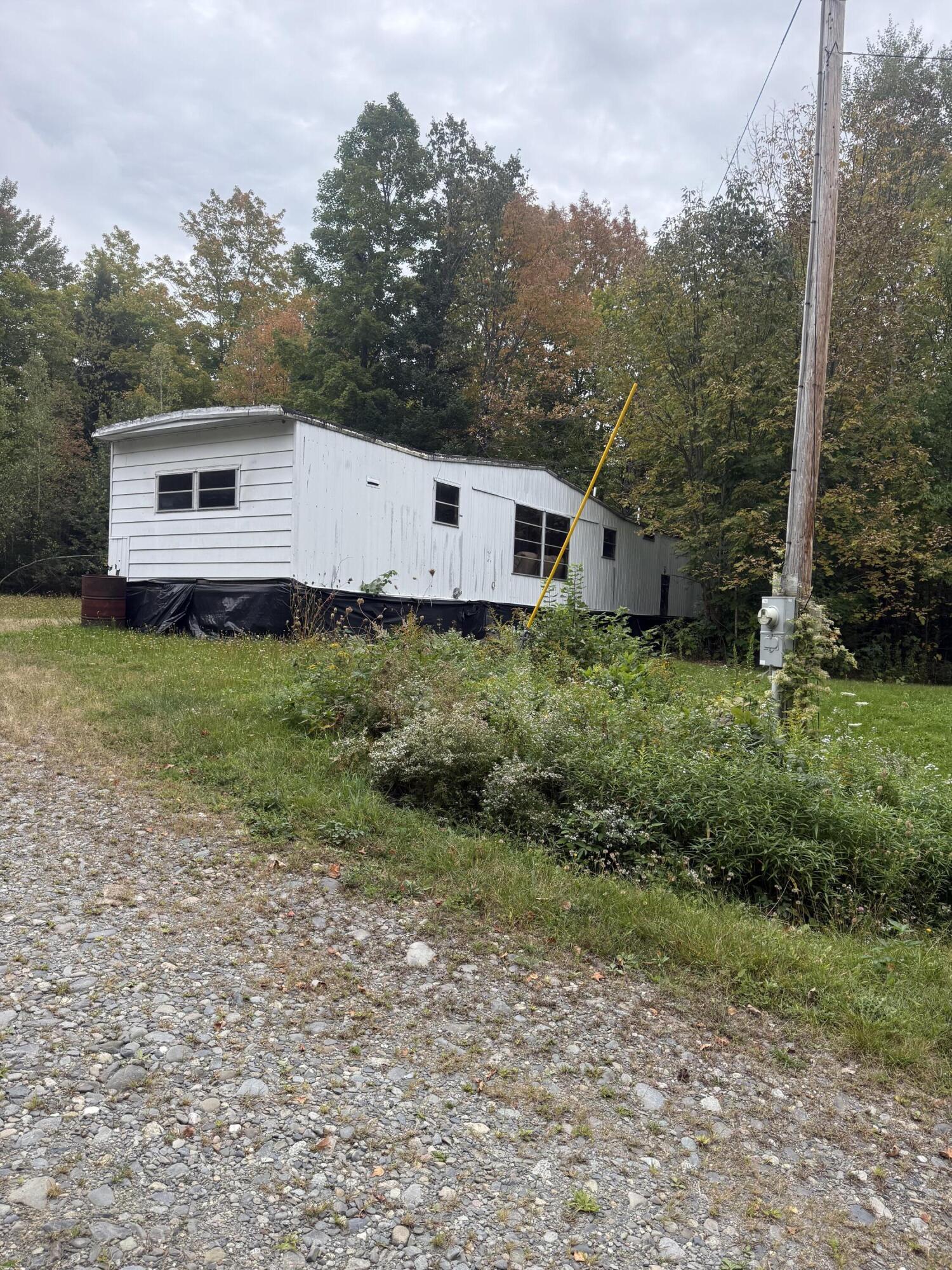 67 Valley Road Athens, ME 04912 - Photo 4 of 13 mobile and lawn back