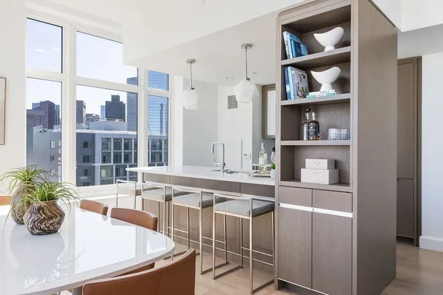 a kitchen with a table and chairs