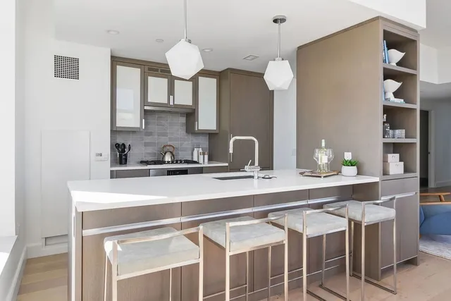 a kitchen with a sink and cabinets