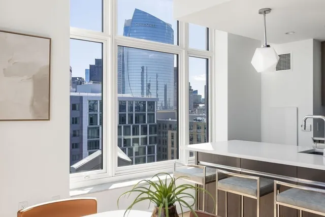 a view of a kitchen area with furniture and windows