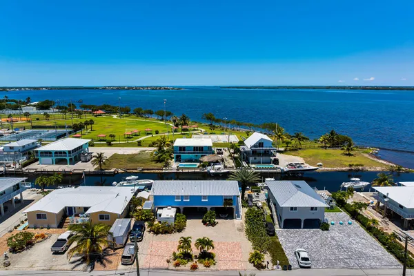 an aerial view of a house with a ocean view