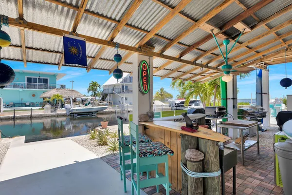 a outdoor living space with furniture and a fireplace