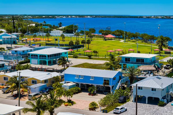 a aerial view of a houses with outdoor space