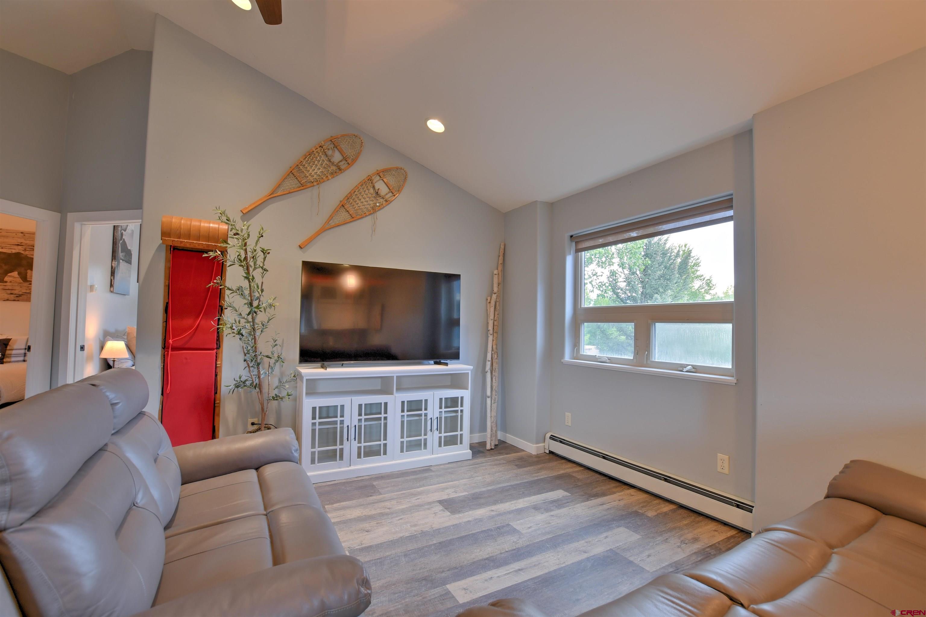 602 Chipeta Drive Ridgway, CO 81432 - Photo 20 of 41 a living room with furniture and a flat screen tv