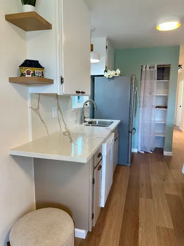 a kitchen with a stove and a sink