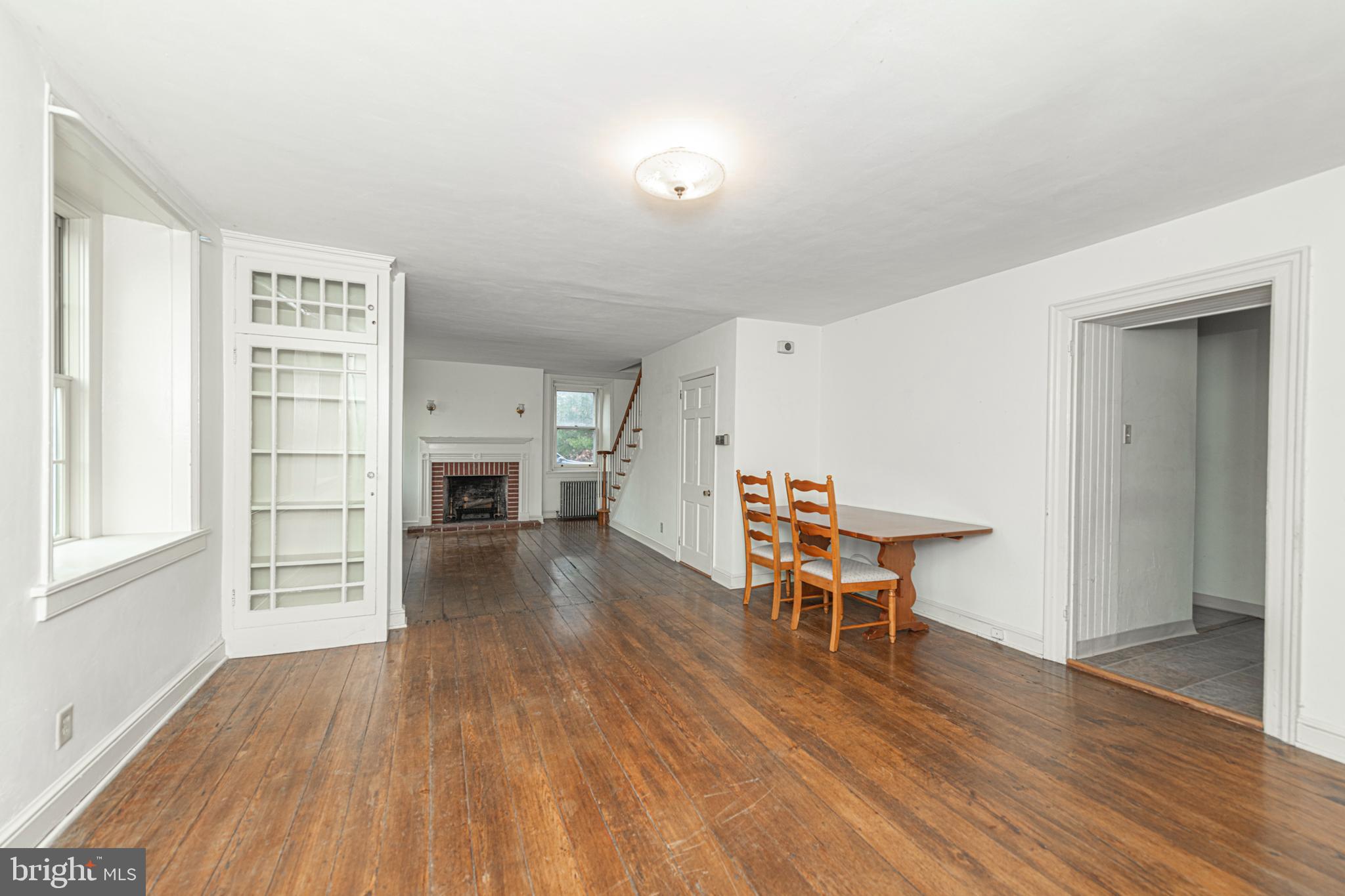 804 Sanatoga Road Pottstown, PA 19465 - Photo 14 of 28 a view of a livingroom with furniture a fireplace wooden floor and window