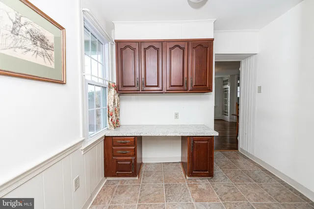 a kitchen with stainless steel appliances a stove and a microwave