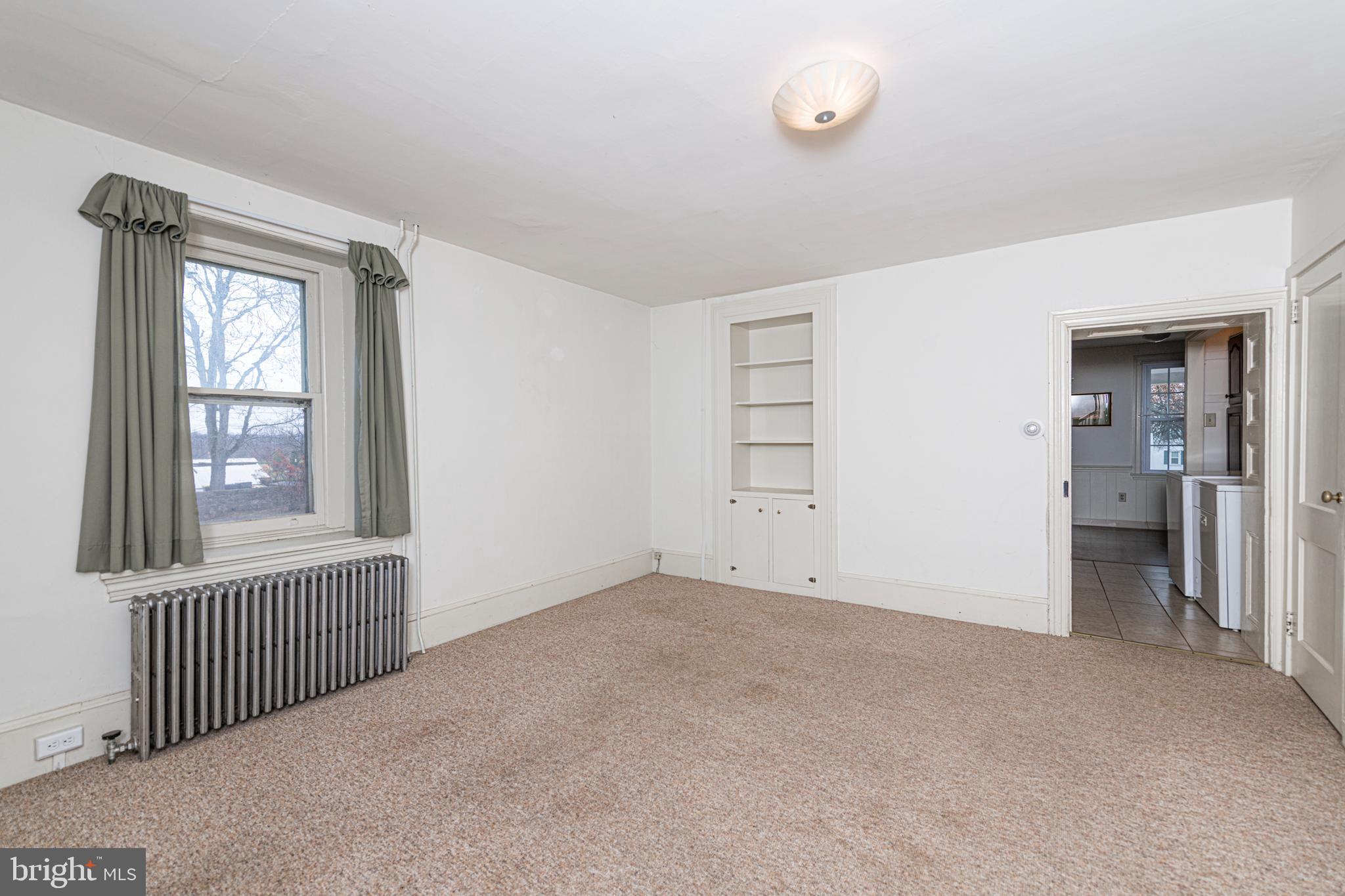 804 Sanatoga Road Pottstown, PA 19465 - Photo 9 of 28 an empty room with windows