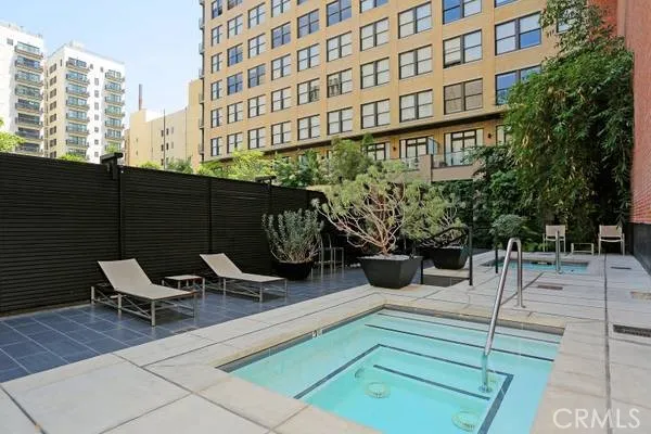 a view of a building with sitting area