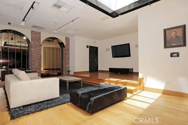 a living room with fireplace furniture and a flat screen tv