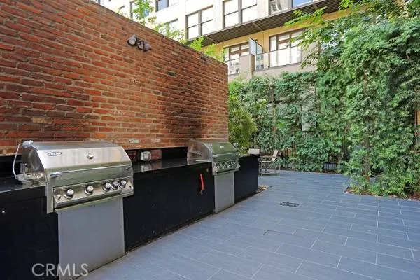 a backyard of a house with stainless steel appliances