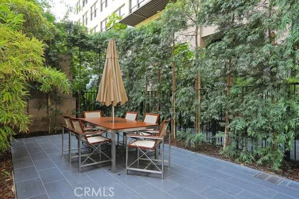 a view of a chairs and table in the patio