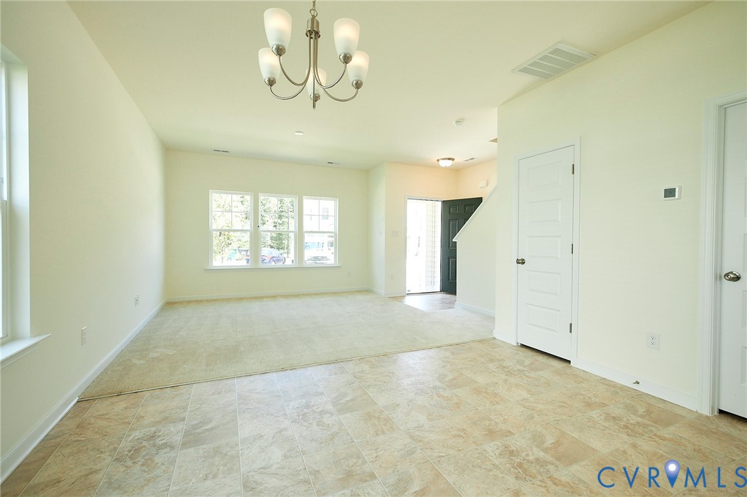 214 Greenpark Road Sandston, VA 23150 - Photo 12 of 50 Unfurnished room featuring a chandelier and light