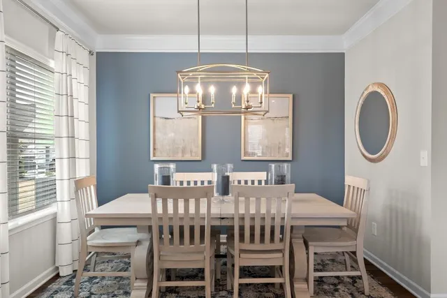 a view of a dining room with furniture window and outside view
