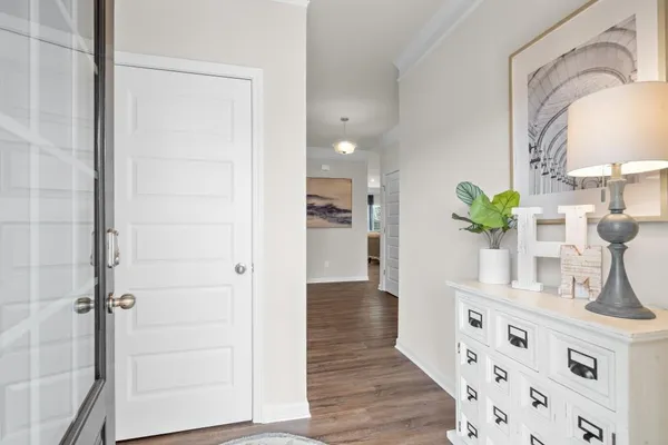a bathroom with a sink a potted plant and a mirror