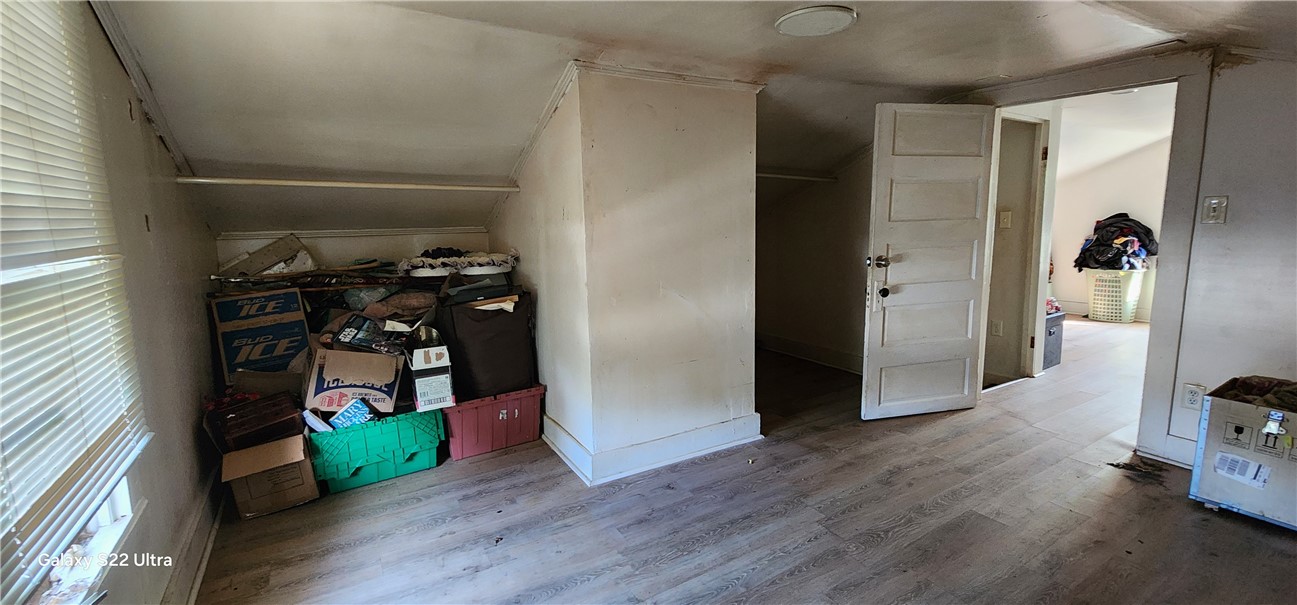 105 Hope Avenue Seneca, SC 29678 - Photo 23 of 33 Functional attic space with wood plank flooring offers practical storage solutions.