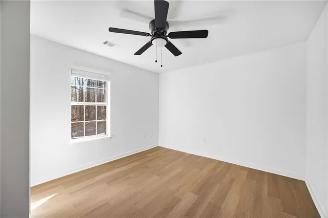 a view of empty room with windows