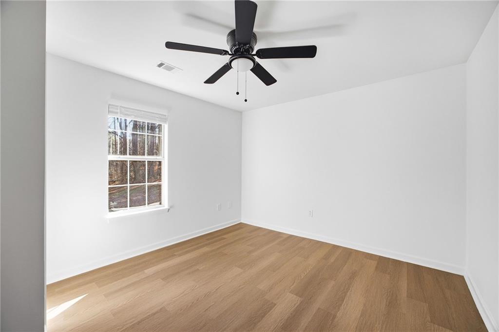 444 McGiboney Road Covington, GA 30016 - Photo 13 of 26 a view of empty room with windows