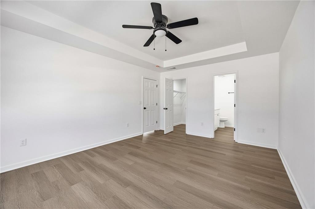 444 McGiboney Road Covington, GA 30016 - Photo 18 of 26 a view of empty room with wooden floor