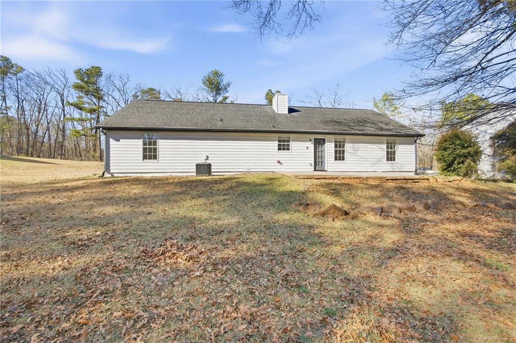 444 McGiboney Road Covington, GA 30016 - Photo 23 of 26 a view of a house with a yard