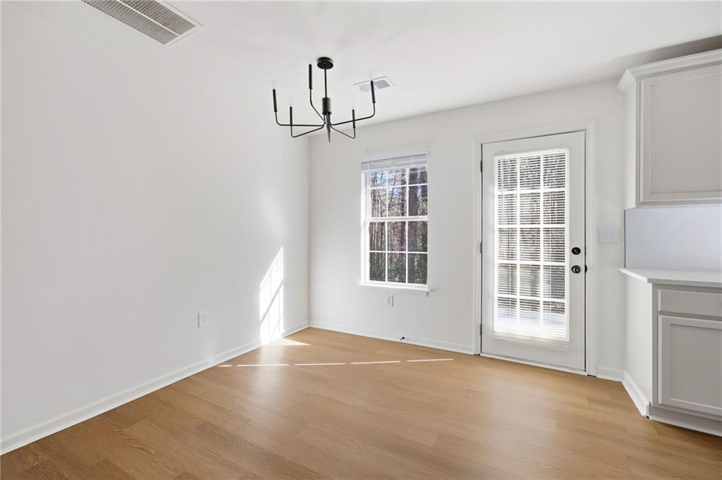 444 McGiboney Road Covington, GA 30016 - Photo 7 of 26 an empty room with windows