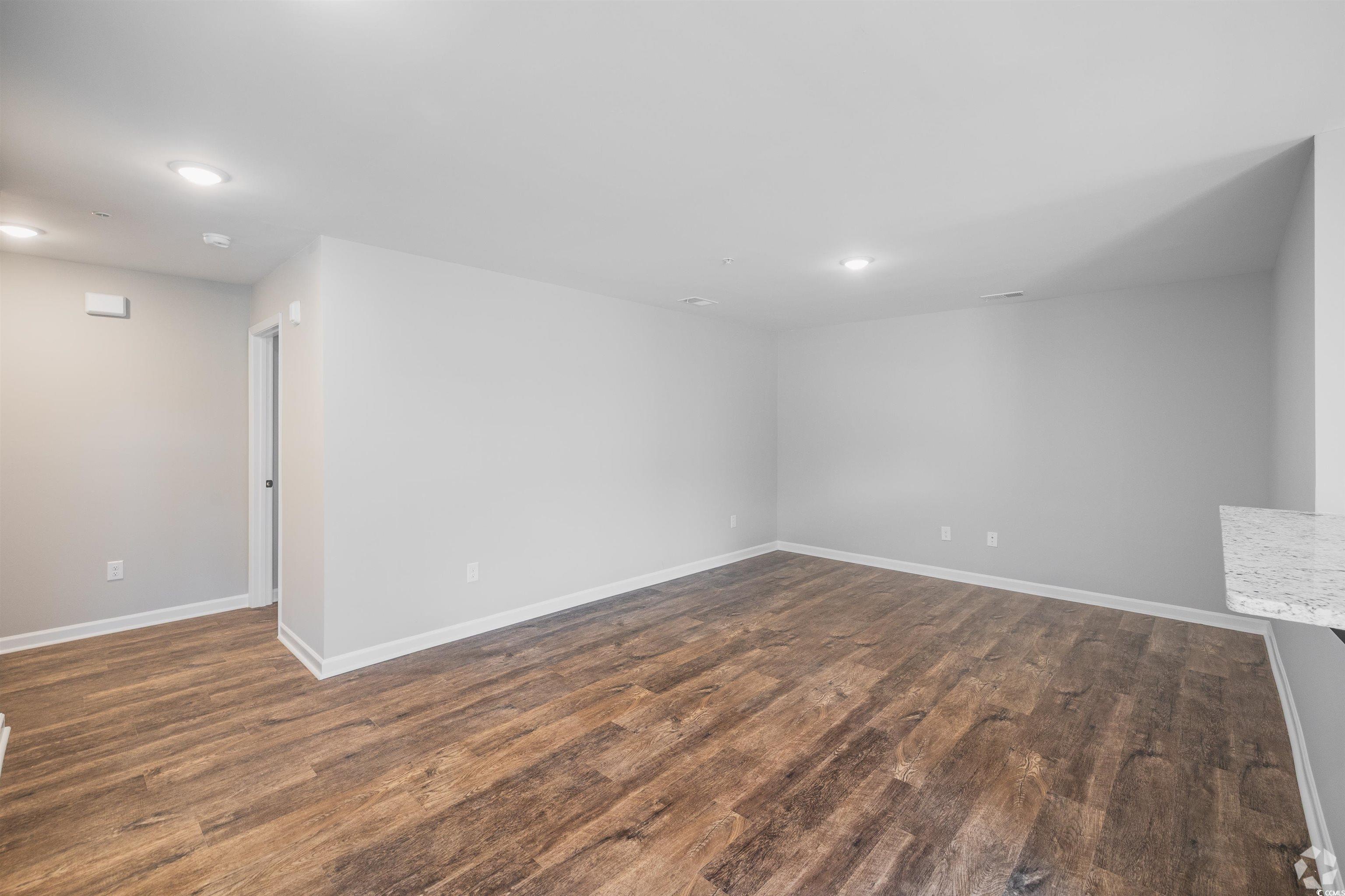 318 South Black Swamp Court, Unit 202 Conway, SC 29526 - Photo 3 of 8 Spare room with dark wood-style floors and recessed lighting
