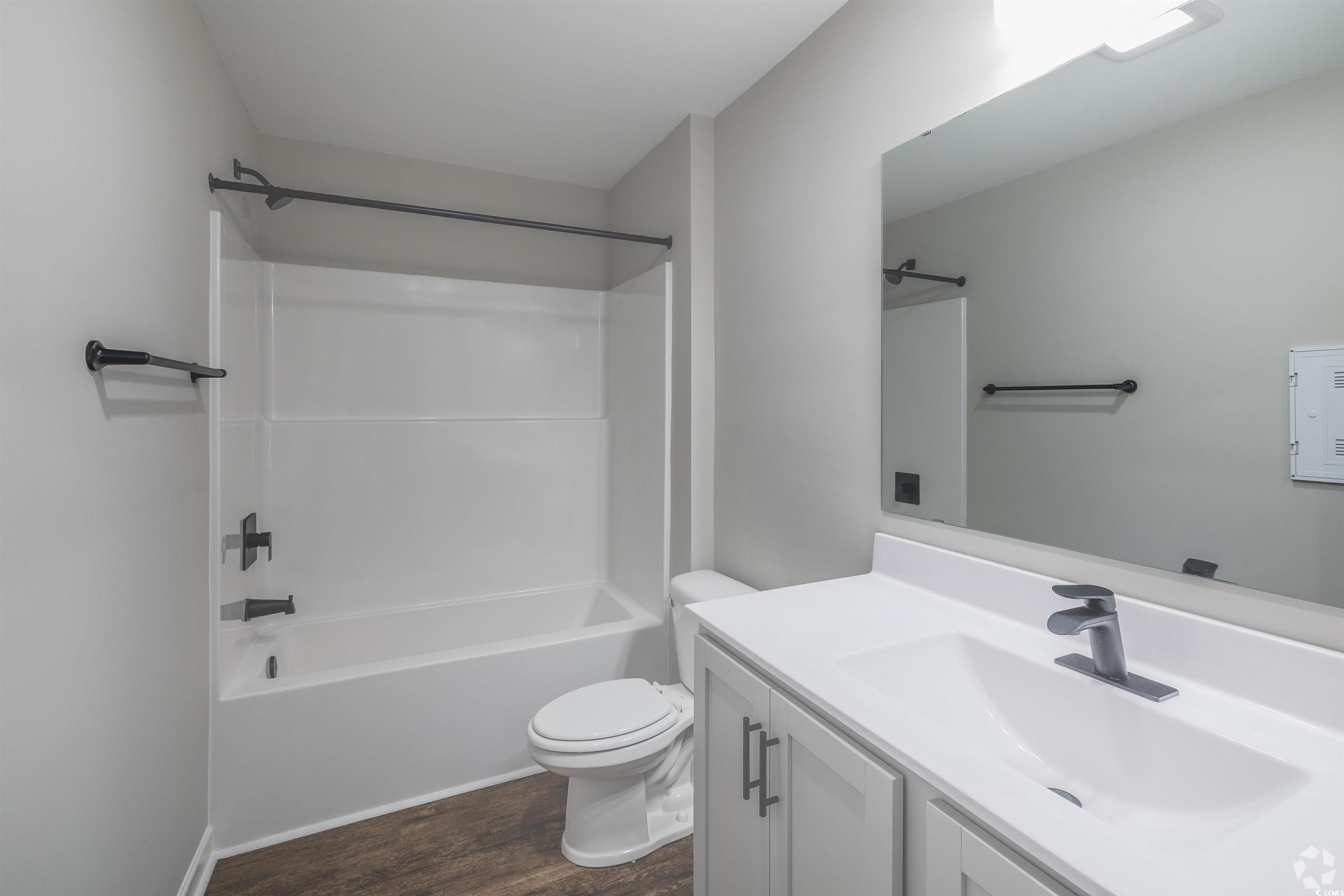 318 South Black Swamp Court, Unit 202 Conway, SC 29526 - Photo 7 of 8 Full bathroom with bathing tub / shower combination, vanity, and dark wood finished floors