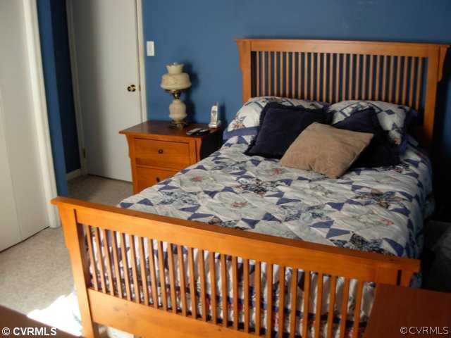 6020 Barrister Road Chesterfield, VA 23832 - Photo 11 of 12 a bed sitting in a bedroom next to a window
