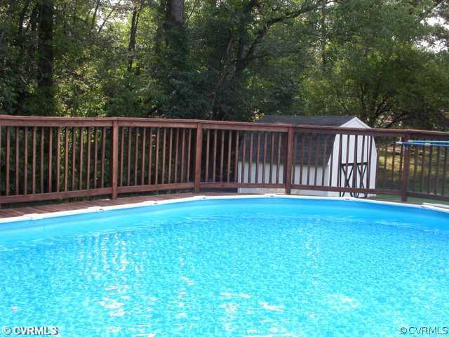 6020 Barrister Road Chesterfield, VA 23832 - Photo 5 of 12 a view of backyard with wooden fence and trees
