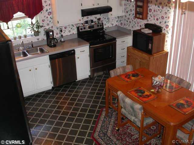 6020 Barrister Road Chesterfield, VA 23832 - Photo 7 of 12 a kitchen with a sink appliances and cabinets