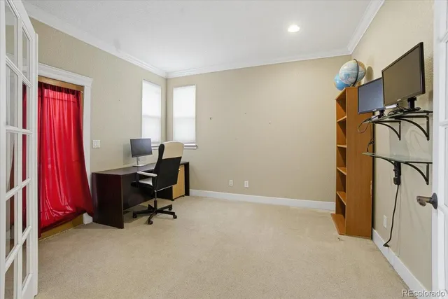 a view of an empty room with a fireplace and a window