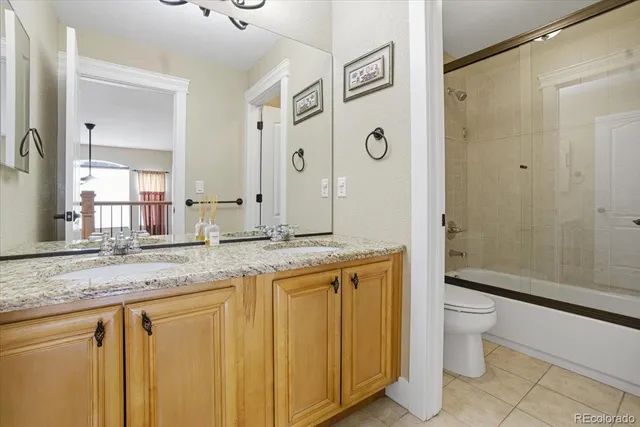 a bedroom with a bed and a fireplace