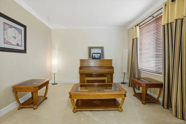 a view of a dining room with furniture a chandelier and wooden floor