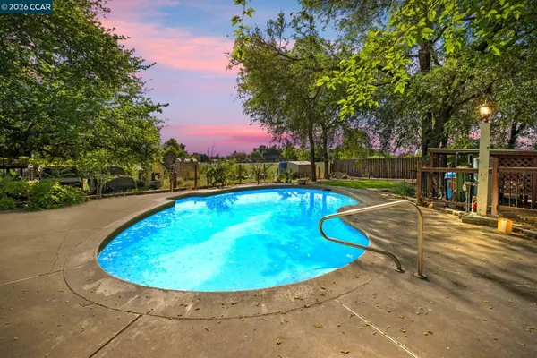 a view of a swimming pool with an outdoor space