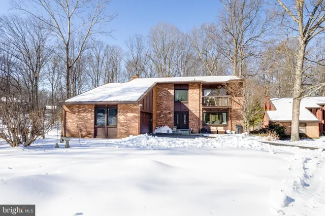 a view of a building with a snow on the road